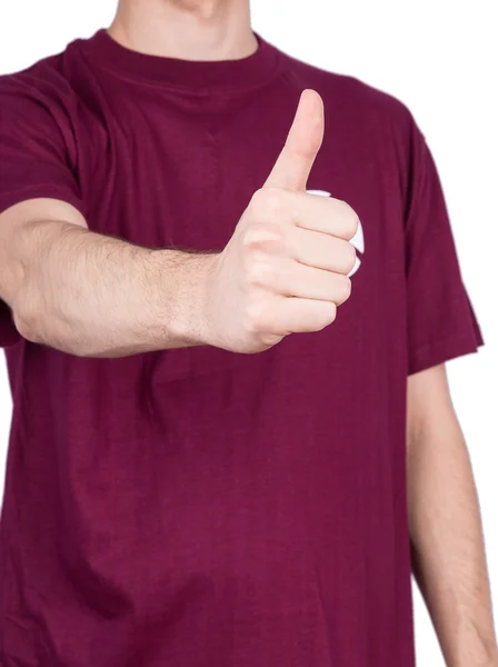 Man in T-shirt shows thumbs up — Stock Photo, Image