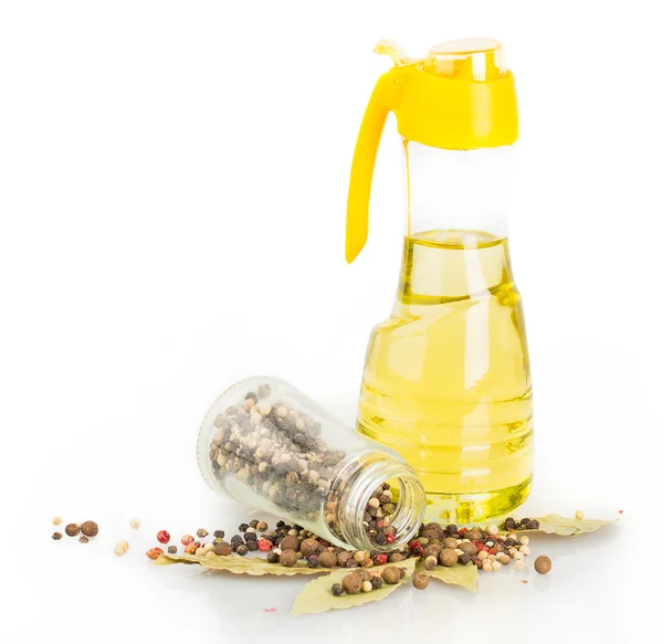 Glass bottle, bay leaf, pepper, oil — Stock Photo, Image