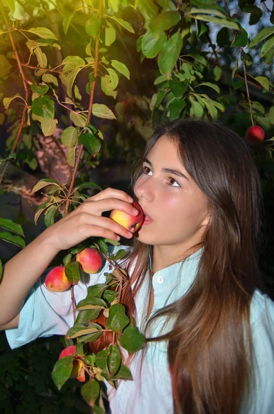 Beautiful girl eats tasty apple