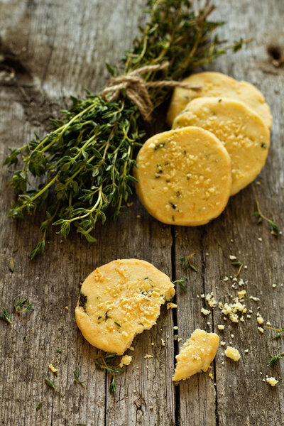Shortbread cookies with thyme and parmesan on a wooden table