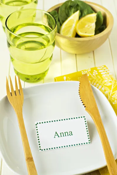 Bright and sunny table setting with a name tag — Stock Photo, Image