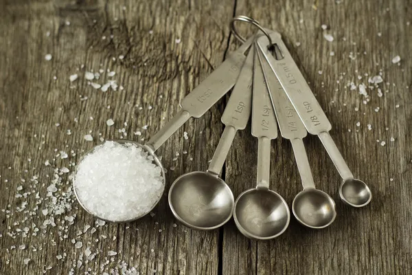 Salt in a measuring spoon — Stock Photo, Image