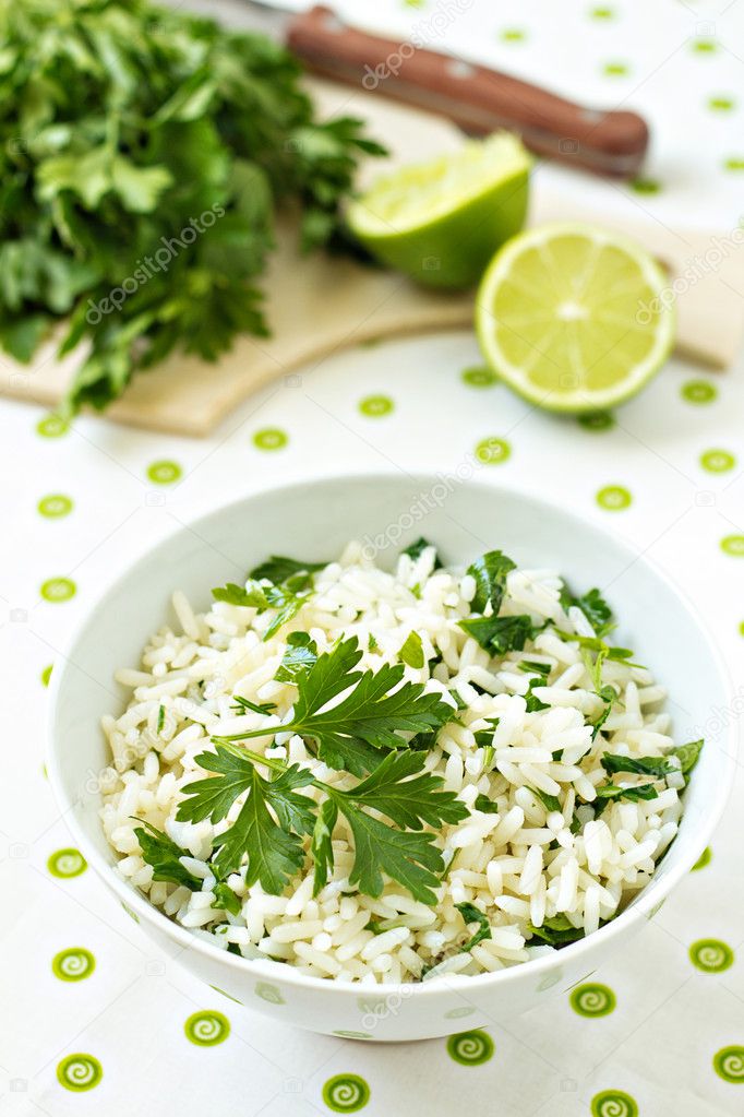 White rice with lime and parsley in a bowl