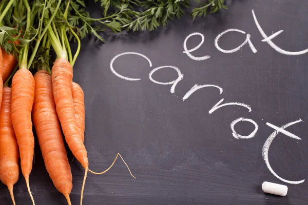 Fresh carrot with green leaves — Stock Photo, Image