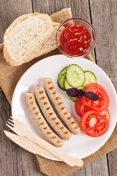 Grilled pork sausages on a plate — Stock Photo, Image