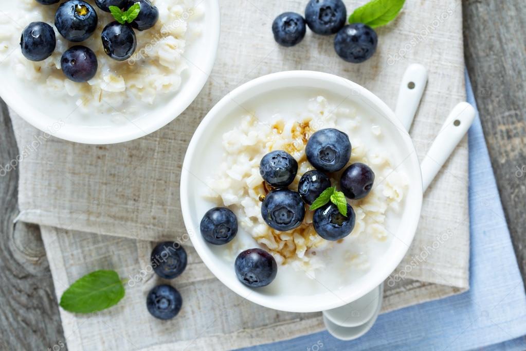 Rice pudding with syrup and berries Stock Photo by ©fahrwasser 48933985