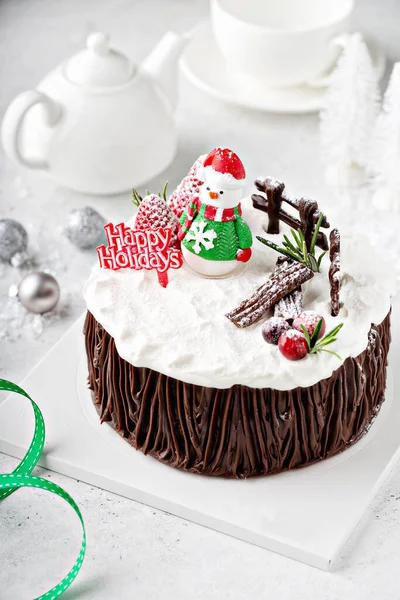 Chocolate Christmas celebration cake with holiday decorations — Stock Photo, Image