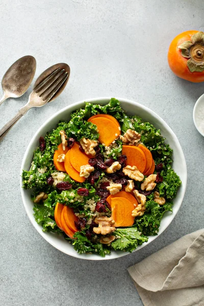 Fall salad with kale, walnuts and persimmon — Stock Photo, Image