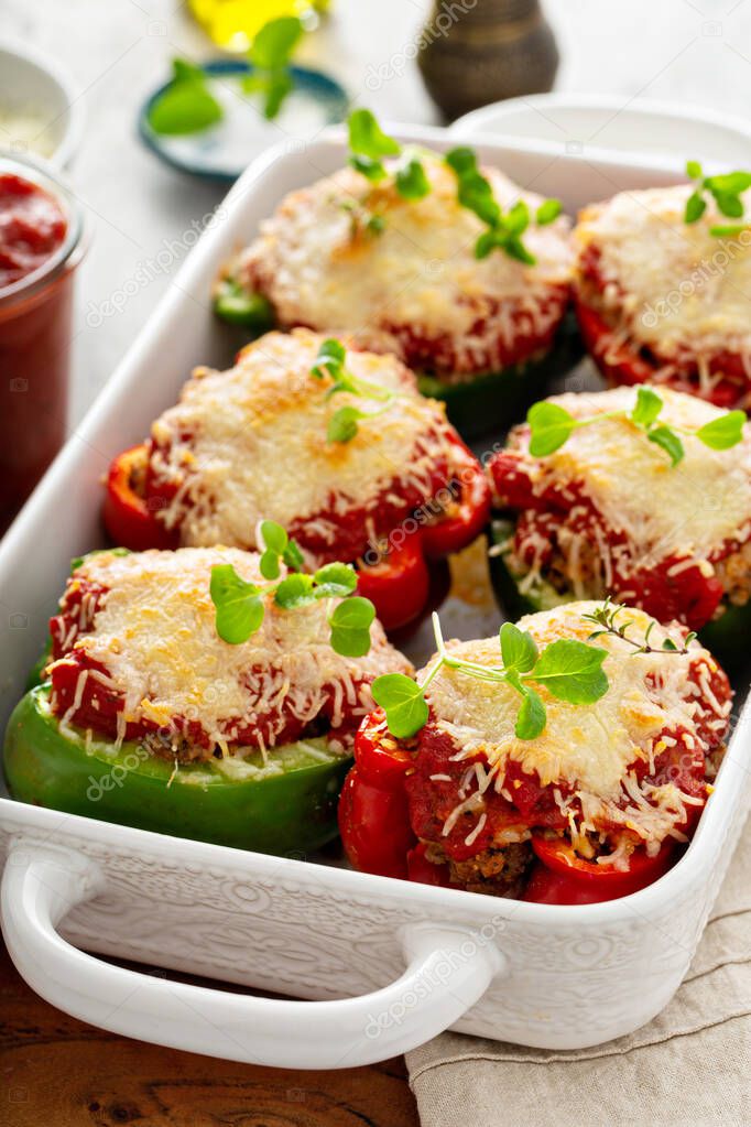 Stuffed peppers with marinara sauce and ground beef