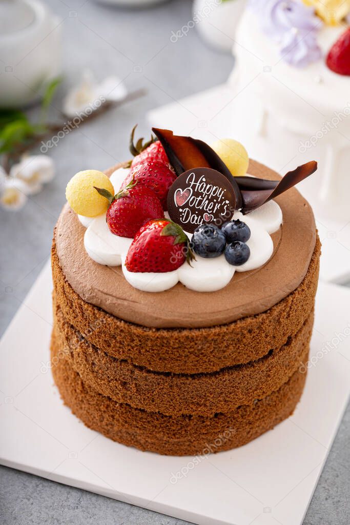 Chocolate cake for Mothers day with berries and chocolate topping