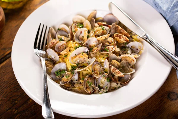Seafood pasta with clams, fresh pasta linguine in a bowl