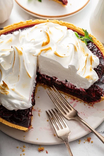 Blackberry pie topped with toasted meringue, fall or summer dessert