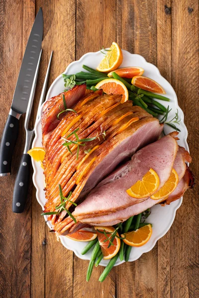Christmas Thanksgiving Spiral Sliced Ham Oranges Herbs Whole Ham Serving — Stock Fotó