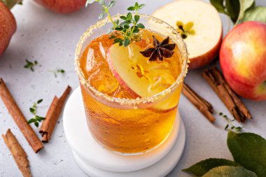 Apple cider margarita with brown sugar rim, cinnamon and fresh thyme, fall cocktail or mocktail idea