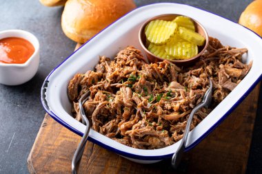 Pulled pork on a serving platter, ready to eat and make sandwiches
