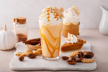 Pumpkin pie milkshake with caramel syrup and whipped cream on top