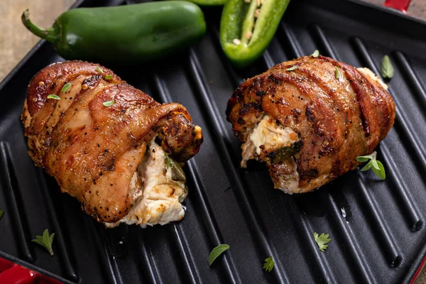 Jalapeno popper chicken wrapped in bacon and stuffed with jalapeno and cream cheese