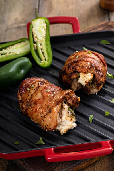 Jalapeno popper chicken wrapped in bacon and stuffed with jalapeno and cream cheese