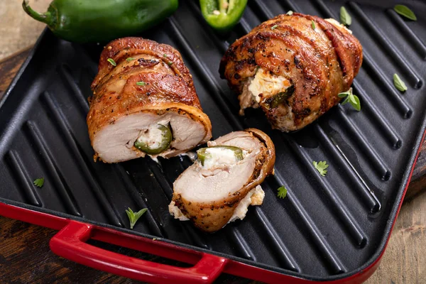 Jalapeno popper chicken wrapped in bacon and stuffed with jalapeno and cream cheese