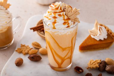 Pumpkin pie milkshake with caramel syrup and whipped cream on top