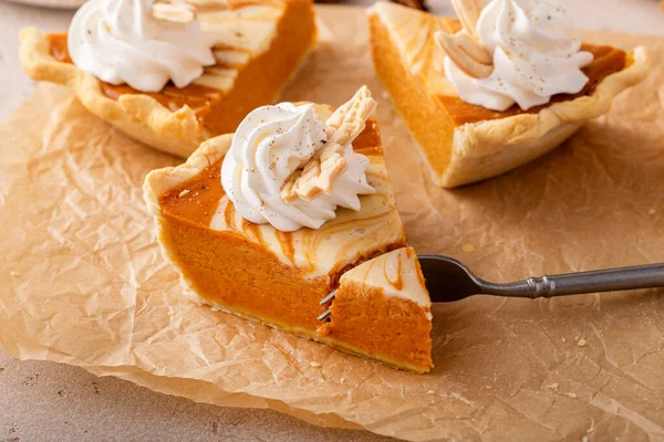 Slice Pumpkin Cheesecake Swirl Pie Topped Whipped Cream Bite Taken — Photo