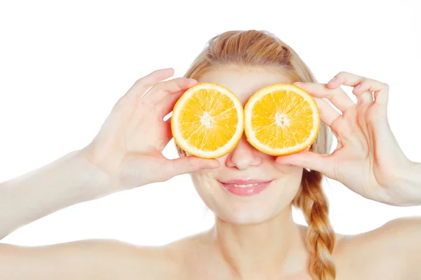 Young woman with oranges — Stock Photo, Image