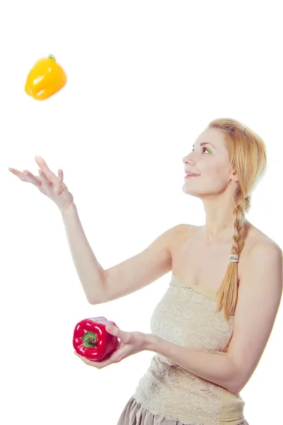 Woman with yellow and red peppers — Stock Photo, Image