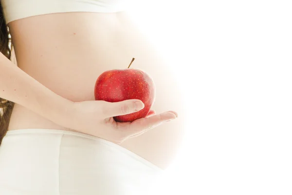 Schwangere mit rotem Apfel — Stockfoto