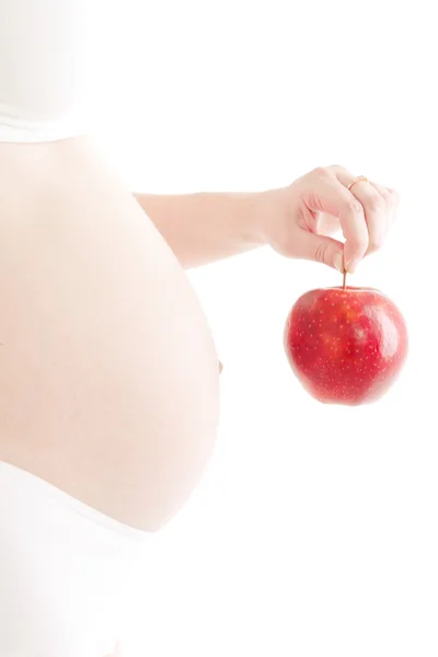 Mujer embarazada con manzana roja — Foto de Stock