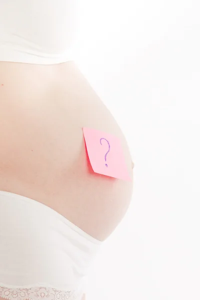 Pregnant woman with sticker — Stock Photo, Image