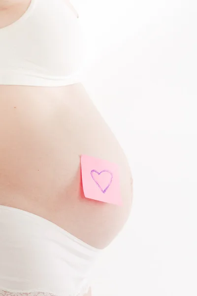 Gravid kvinna med klistermärke — Stockfoto