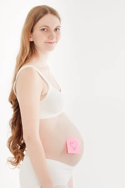 Těhotná žena s nálepkou — Stock fotografie