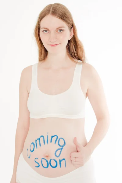 Mulher grávida com legenda no estômago — Fotografia de Stock