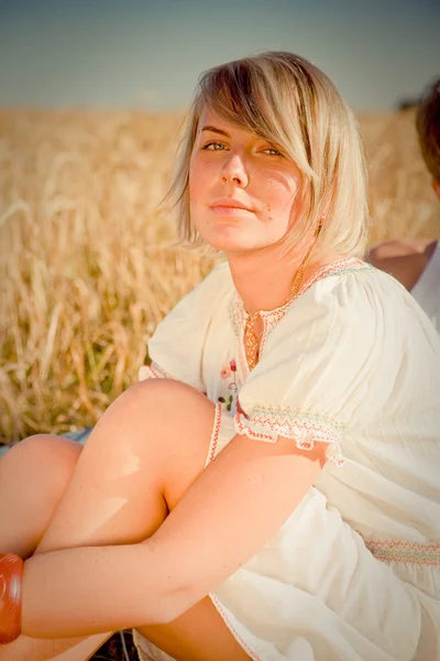 Image of young man and woman on wheat field — Stock Photo, Image