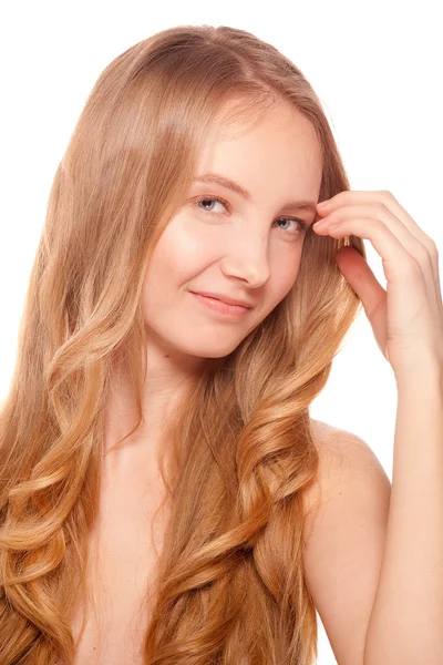 Beautiful woman touching her hair and face Stock Photo