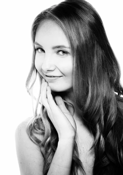 Beautiful woman touching her hair and face — Stock Photo, Image