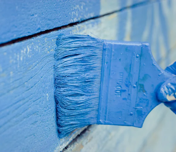 Hand schilderij blauw houten muur — Stockfoto