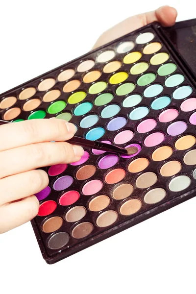 Beautiful girl with multicolor eyeshadow palette — Stock Photo, Image
