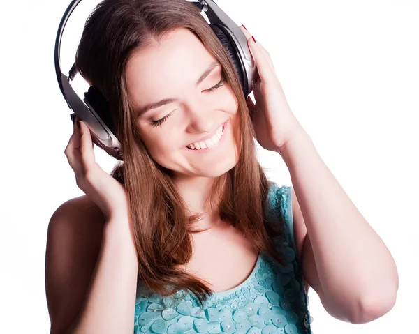 Lány fejhallgatóval énekel a fehér háttér — Stock Fotó
