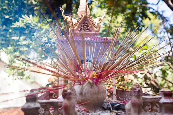 Offerings to gods in temple with aroma sticks — Stock Photo, Image