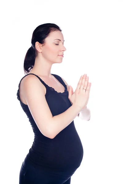 Smuk gravid kvinde praktiserer yoga - Stock-foto
