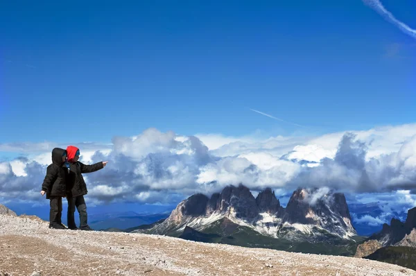 two kids exploring mountains
