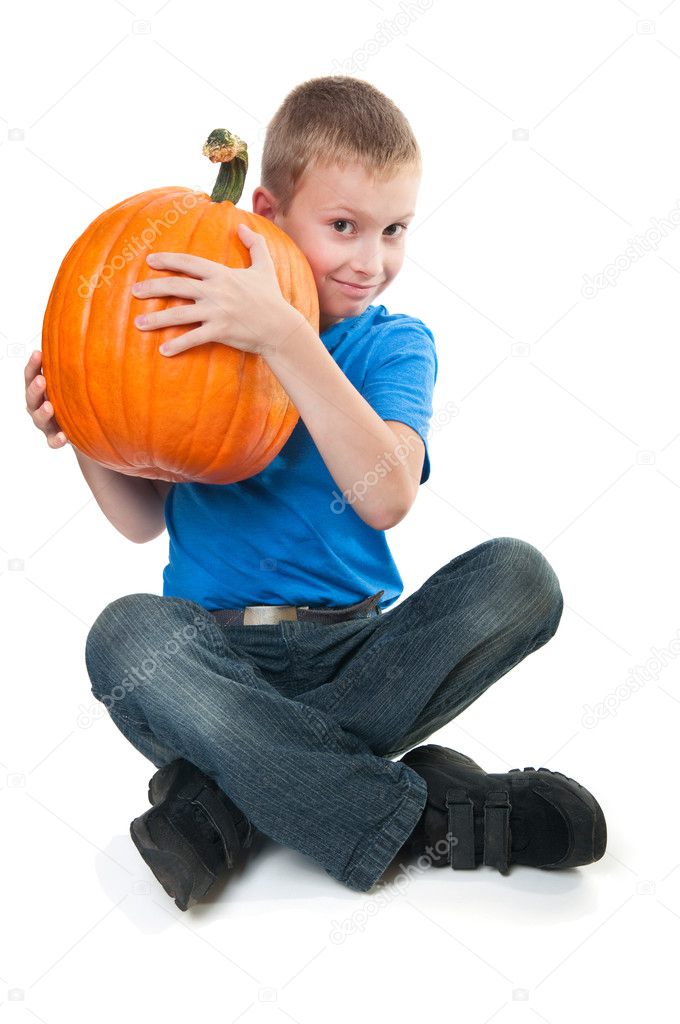 boy holding pumpkin