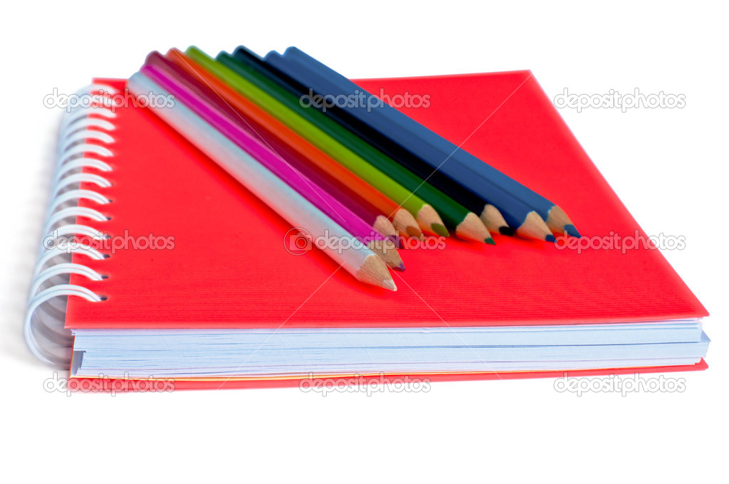 orange notebook and color pencils