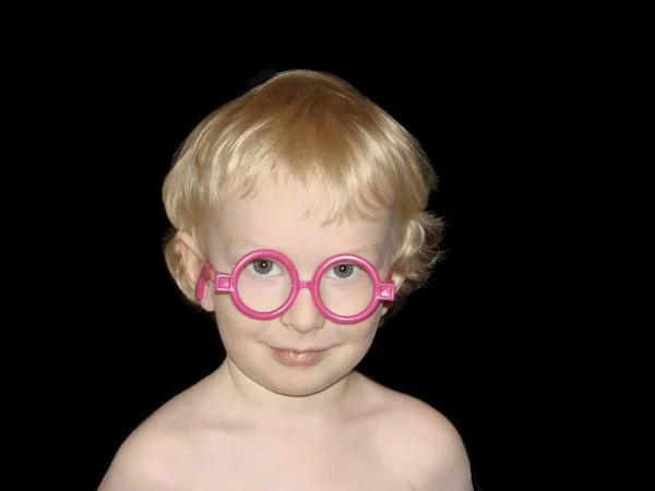 Adorable smiling boy wearind toy glasses — Stock Photo, Image