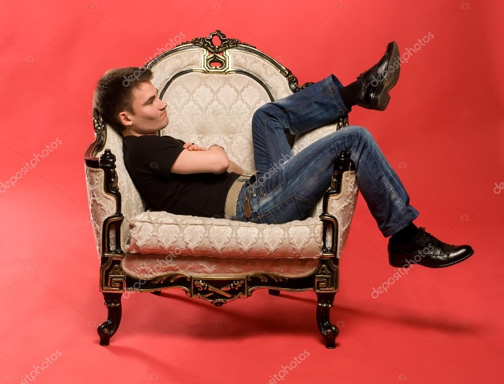 depositphotos_12861269-stock-photo-young-man-sitting-in-armchair.jpg