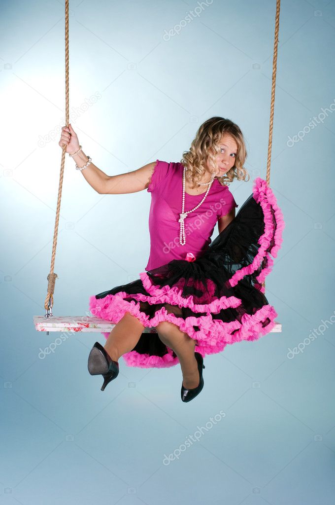 young woman swinging