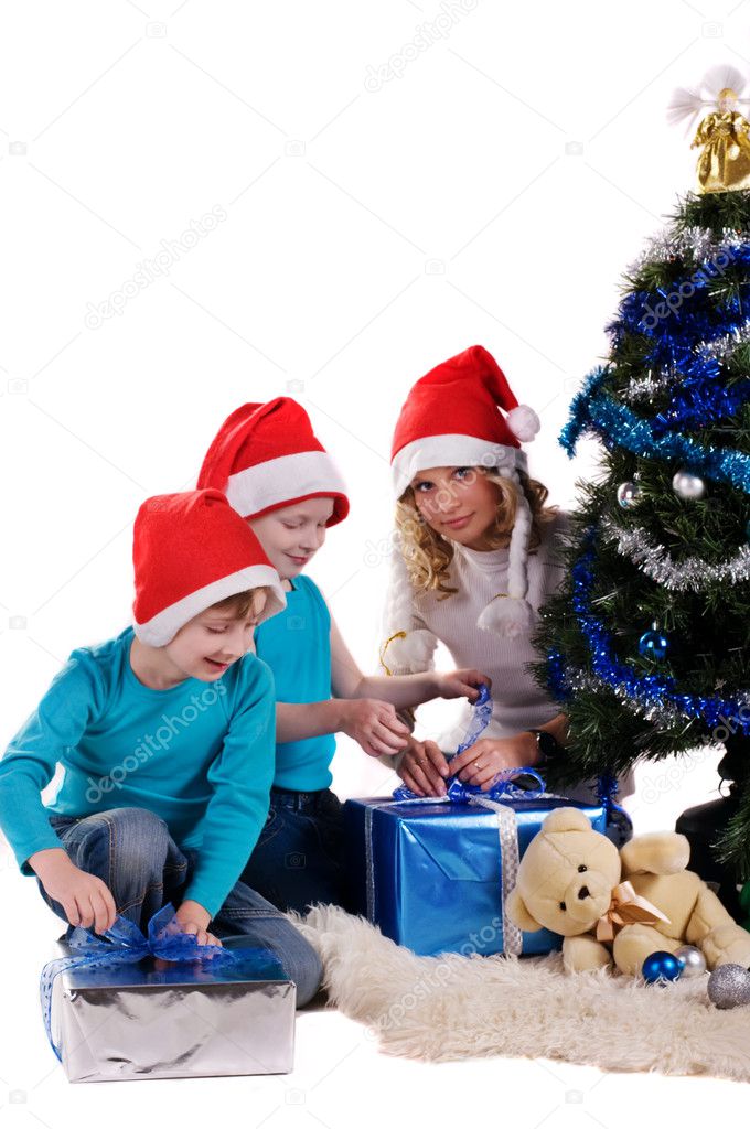 happy family unwraping christmas gifts
