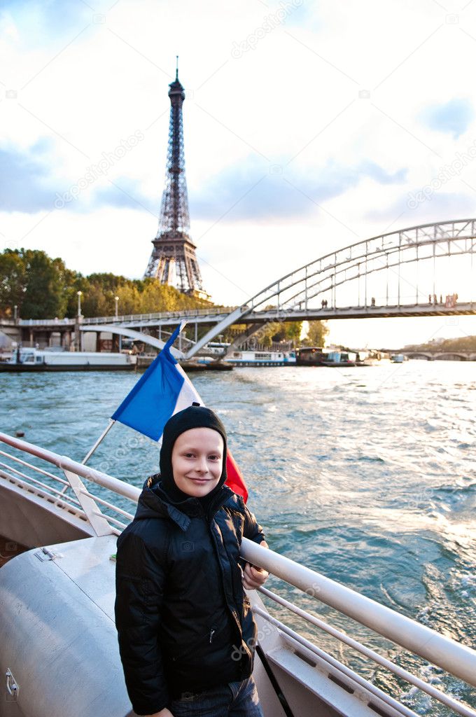 Cute boy travelling in Paris