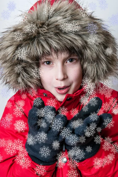 Winter boy blowing christmas wishes — Stock Photo, Image